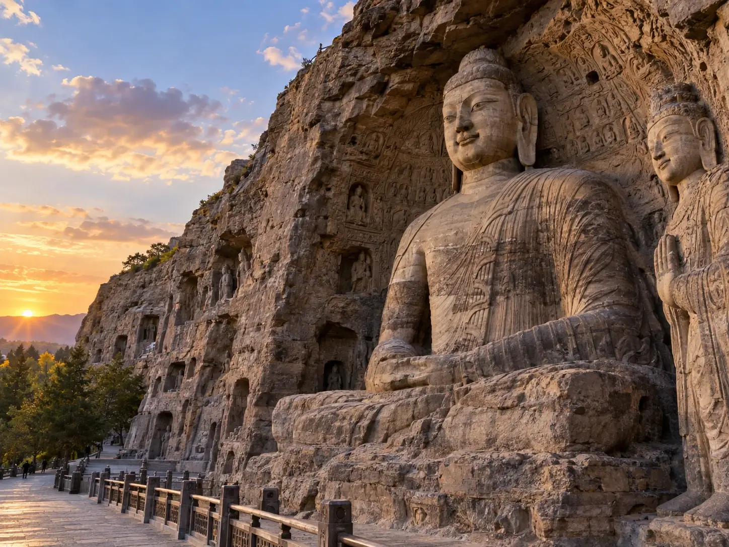 The giant seated Buddha carved into the sandstone cliff of the Yungang Grottoes at sunset