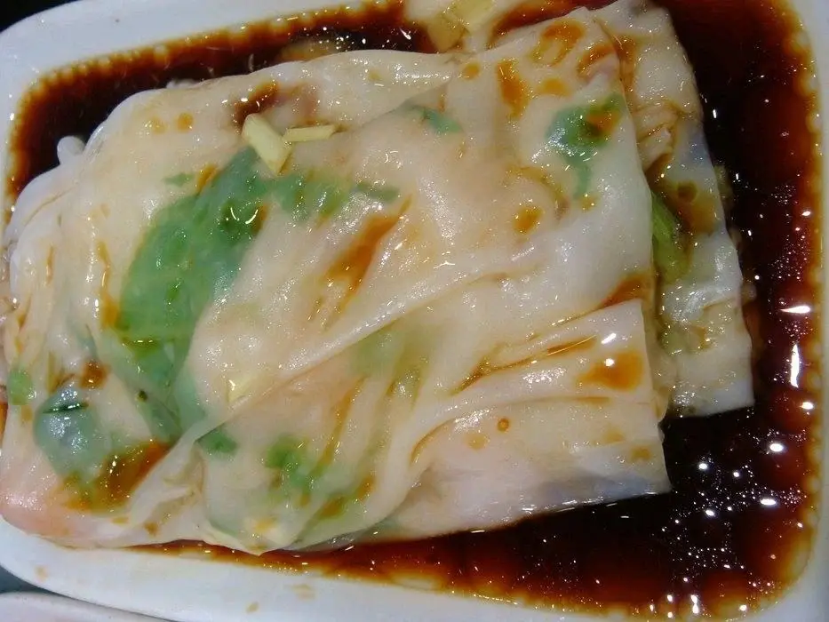 Silky rice noodle rolls brushed with soy sauce and spring onion