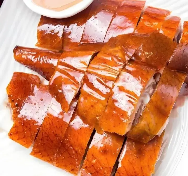 Roast goose with crisp lacquered skin, cut and plated