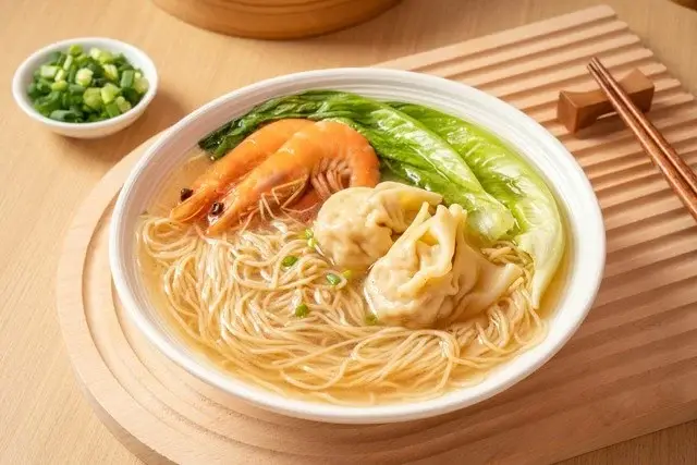 Wonton noodle soup with bamboo-pressed noodles, shrimp wontons and spring onion