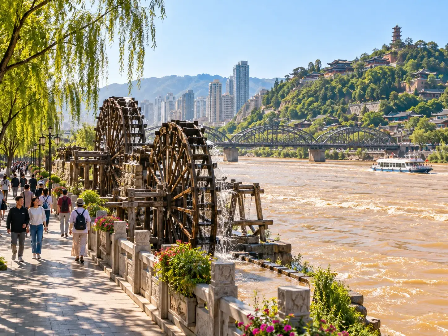 Traditional wooden water wheels turning by the Yellow River, with the riverside promenade, willows, Zhongshan Bridge and Baitashan behind