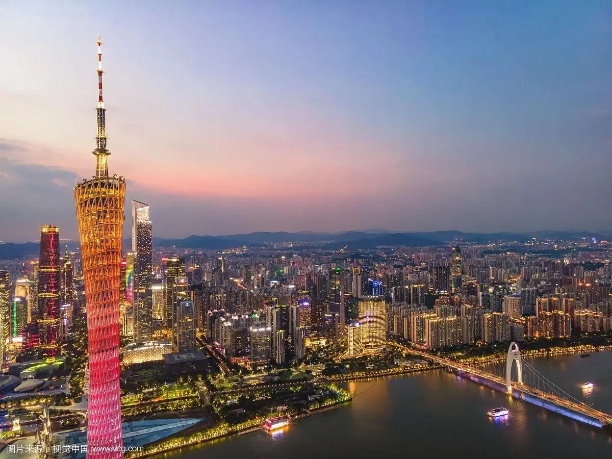Guangzhou skyline at night — Canton Tower and the Pearl River in light