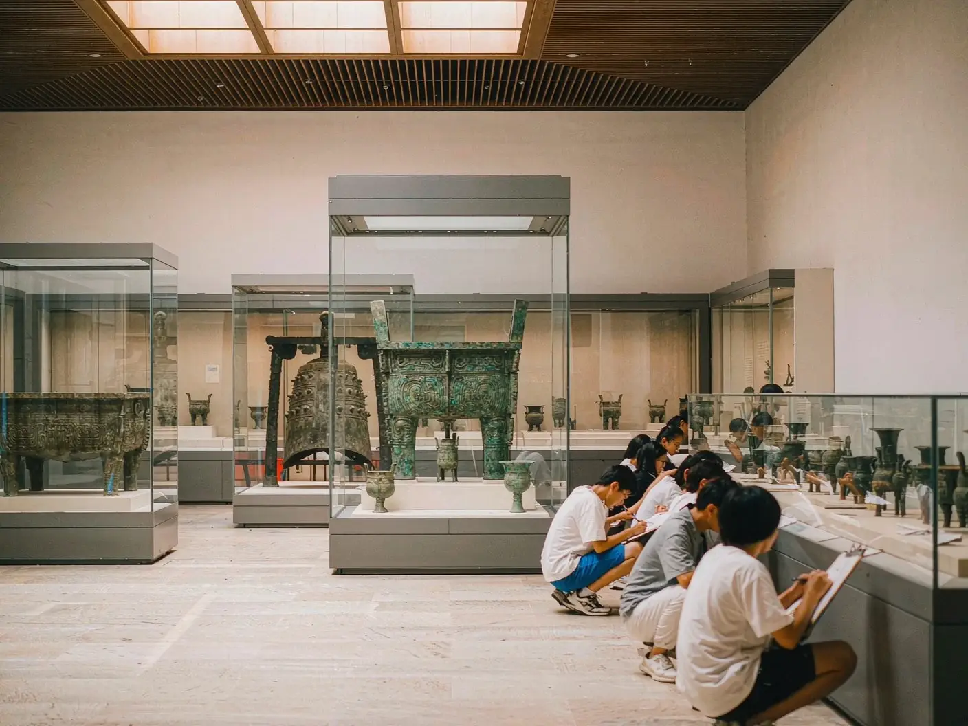 Students sketching bronzes in the National Museum of China