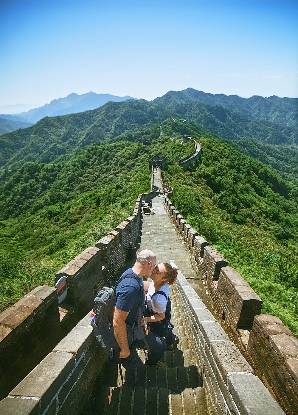 A couple walking hand in hand along the Great Wall