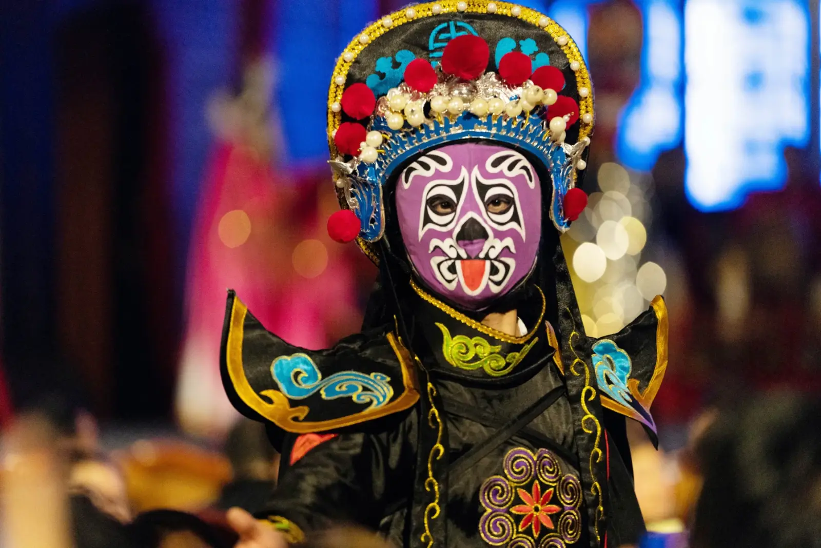 A Sichuan opera face-changing performer with an ornate headdress