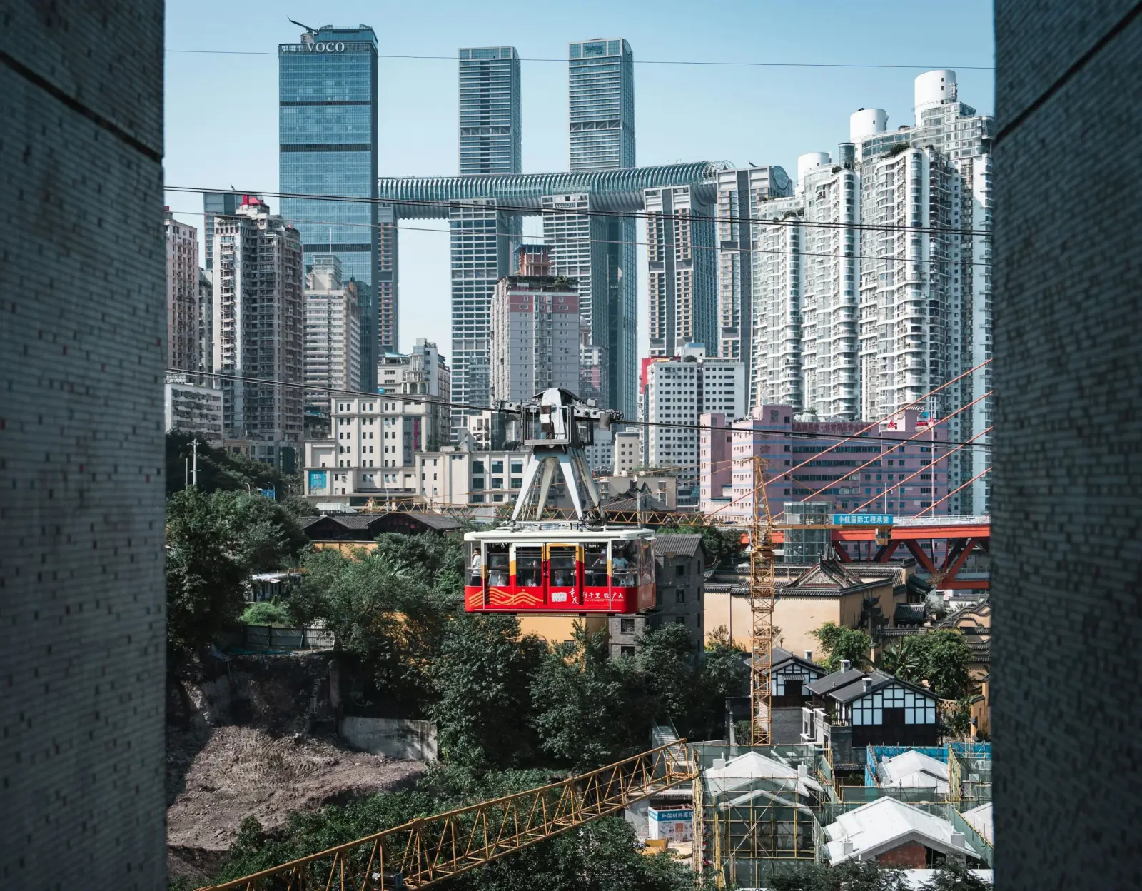 A red Yangtze River cable car above the city