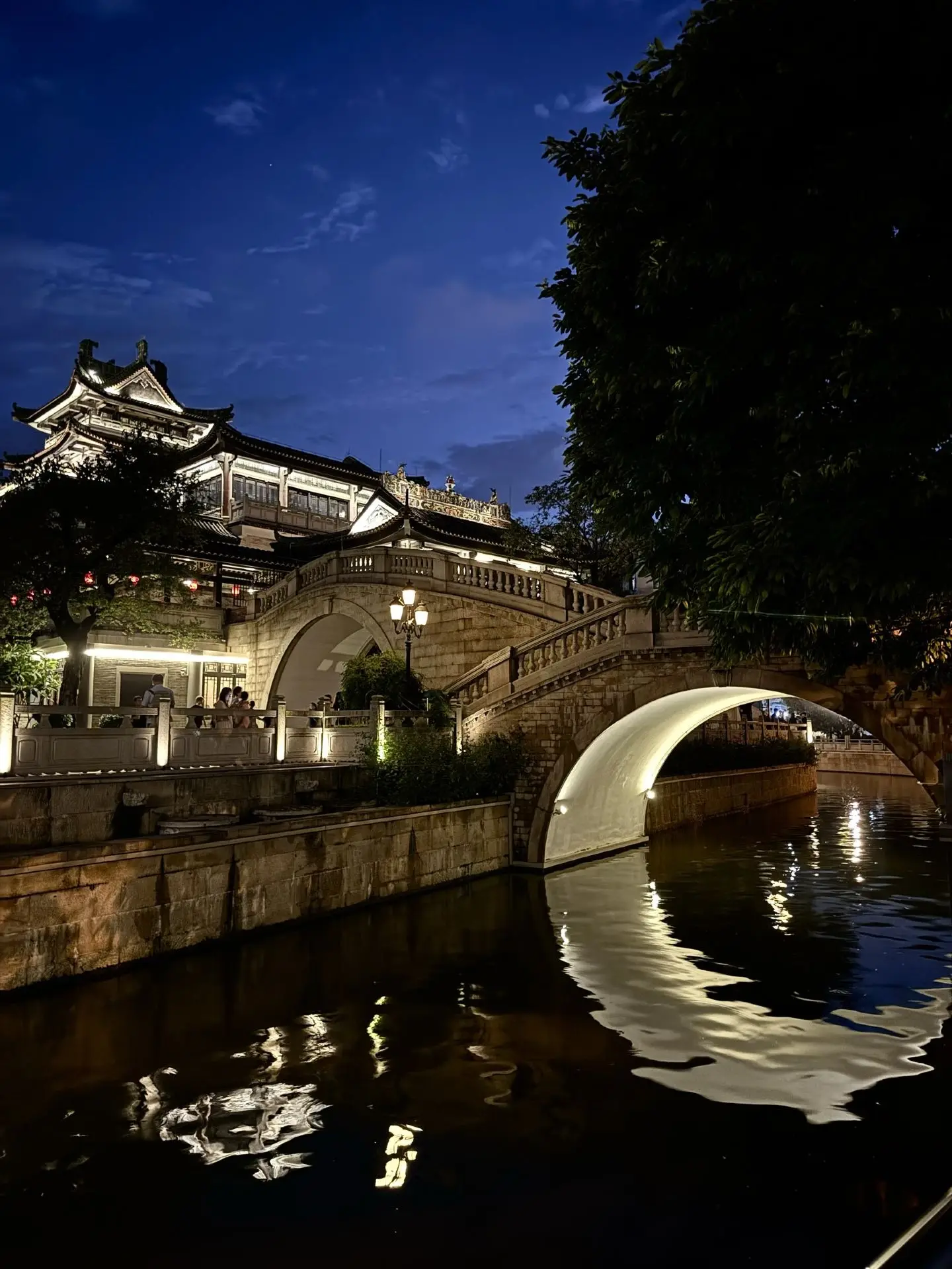 Yongqingfang’s Moon Bridge reflected in the canal at dusk