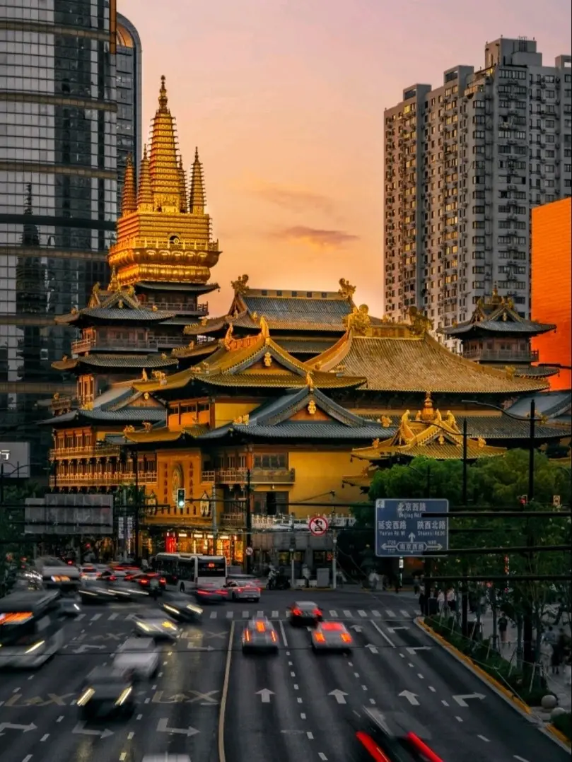 Jing'an Temple rooftops and pagoda against Shanghai towers at sunset