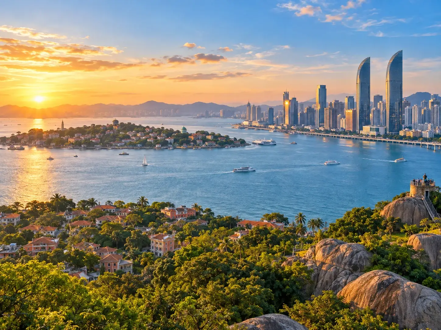 Xiamen bay at sunset — Gulangyu island with red-roof villas and green trees, a modern twin-tower skyline across the water, ferries and a sailboat on the golden sea